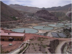 La Caridad copper mine adjacent to La Angostura dam and reservoir with aqueduct in foreground.