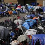Tent camp of migrants at El Chaparral Port of Entry, Tijuana, Mexico - March 2021